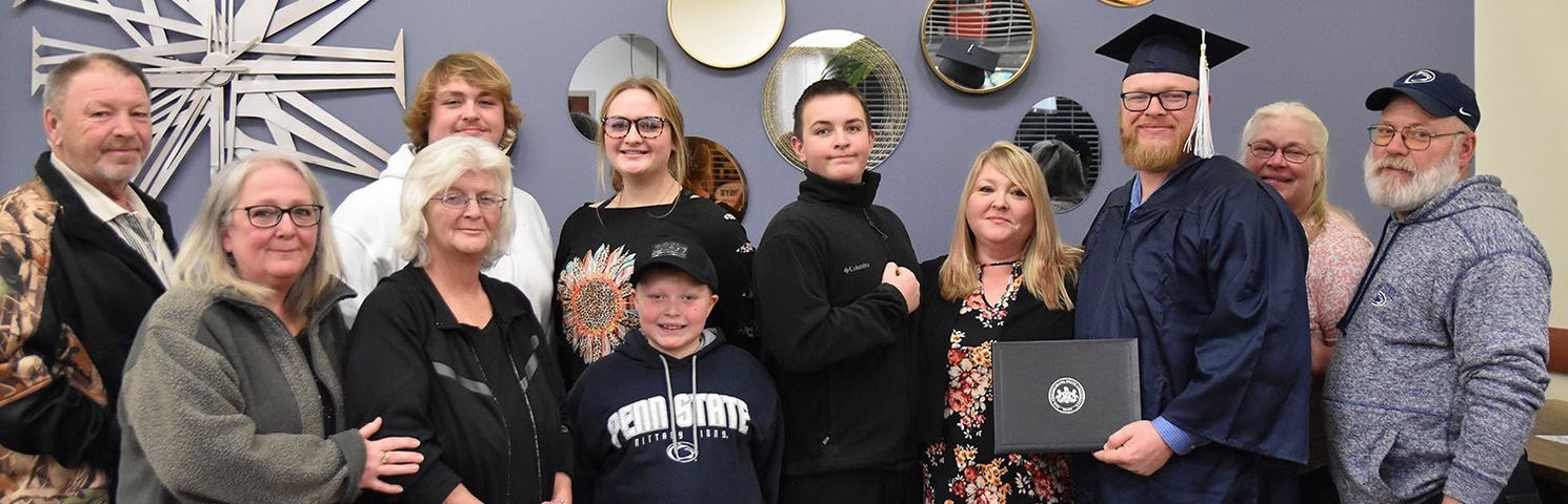 Parents and family members of a new Penn State York graduate.