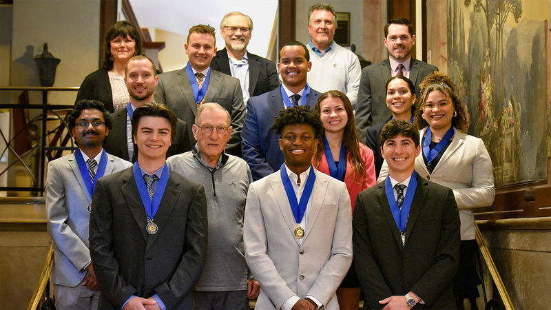 Newly inducted Graham Fellows standing together for a group picture after receiving their Graham Medallions.