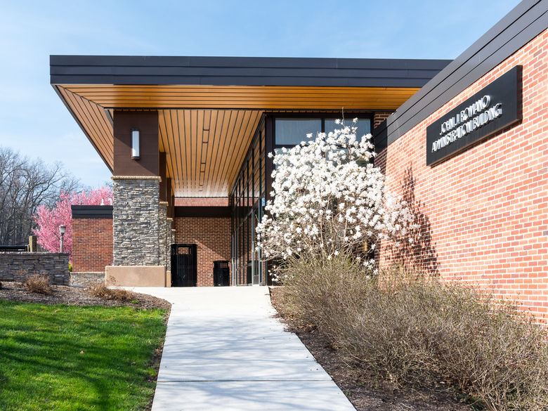 Trees bloom in spring around the Romano building