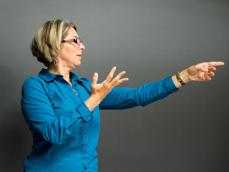 Professor lecturing in front of a class.