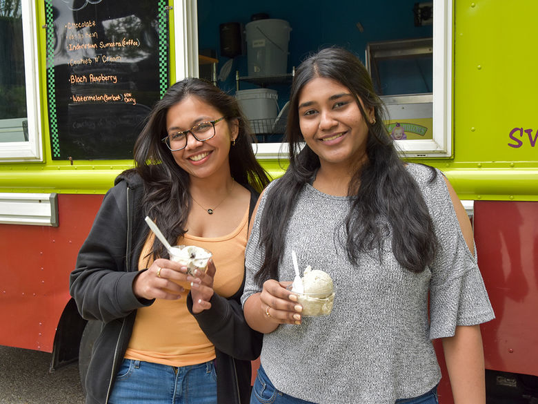 Two students enjoying free ice cream!