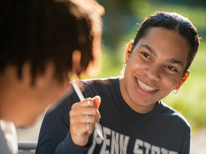 Two students having a conversation.