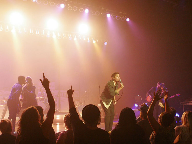Audience and performers during a rock concert at The Pullo Center.