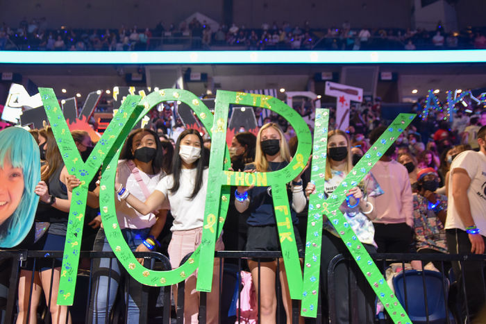 Crowed shot with students holding green wooden letters spelling out York