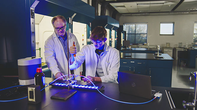 Professor and student in chemistry lab