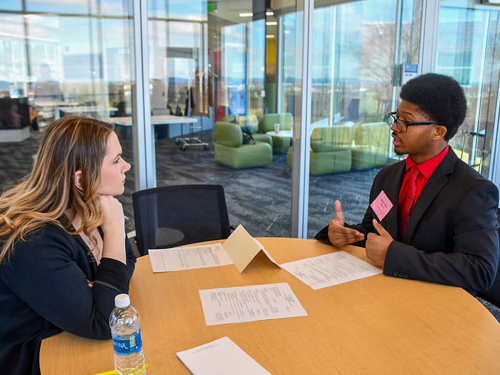Students members of the Future Business Leaders of America (FBLA) Collegiate program participating in a professional critiquing event.