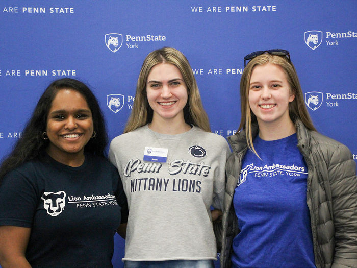 Three students involved in the Lion Ambassador program.