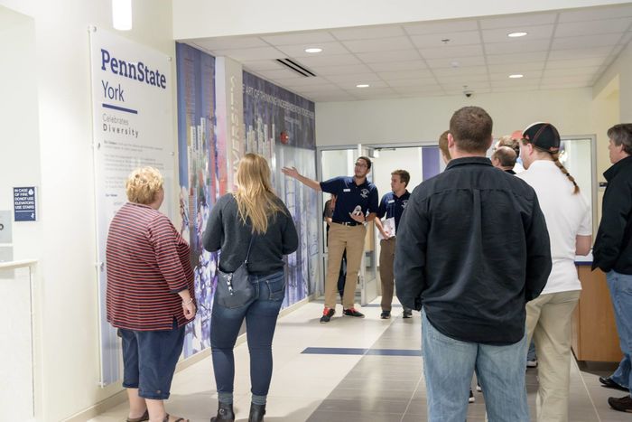 Lion Ambassador Mohamed El Sonbaty gives a tour outside of the Student Affairs office