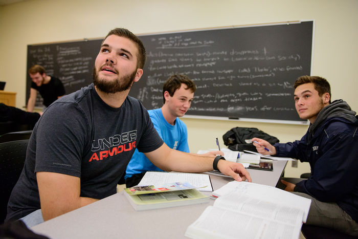 Students working in a group during a political science class with Jon Price, Instructor in History and Political Science.