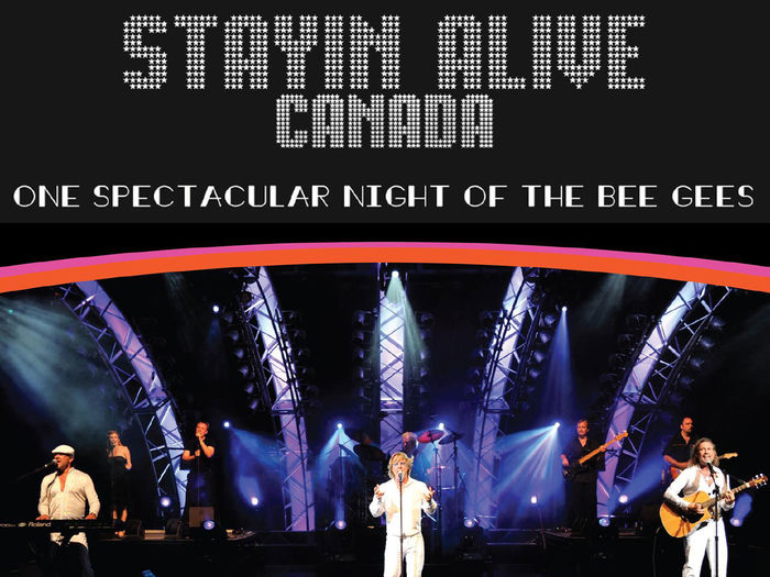 Singers and band members performing on stage with the words Stayin Alive Canada behind them