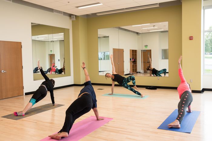 Students taking a yoga class.