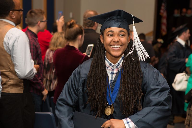 Beaver student Khalia Adams smiles as she walks up the aisle after the commencement ceremony.