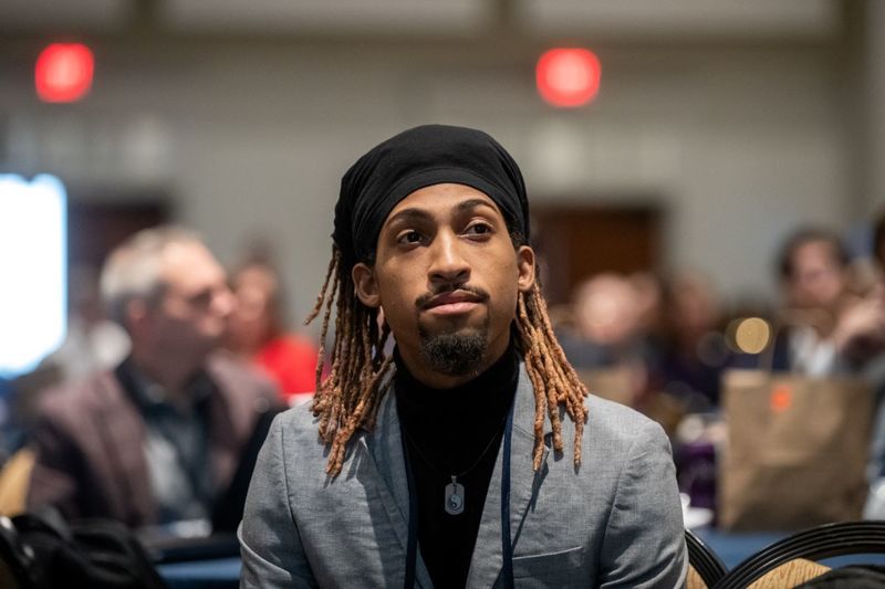 Attendee listening to speaker session during Invent Penn State Venture & IP Conference