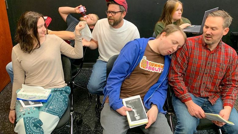 Male and female members of the Penn Players acting out a scene with an annoying audiencxe for "Hamlet"