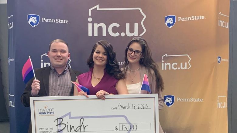 Founders of Bindr with large check