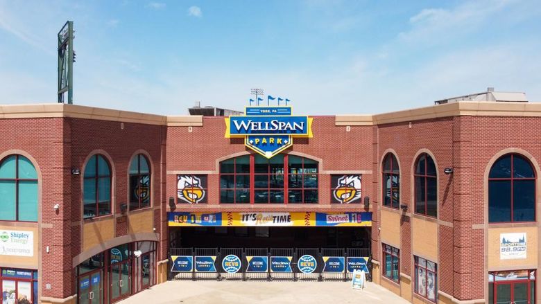 Brick front gates of a baseball park and sign WellSpan Park 