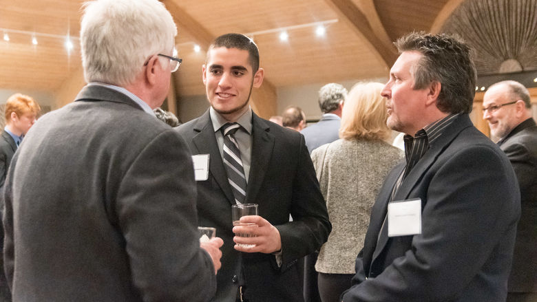 Bill Scott, left and Paul Rudy, The Graham Companies, get to know Graham Center Candidate Tim Perez.