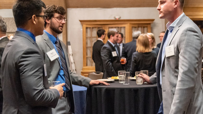 Two students speaking at a Graham Program event