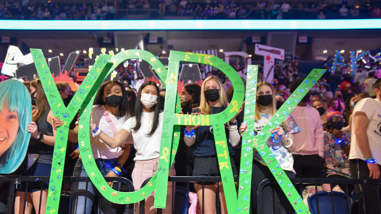 Crowed shot with students holding green wooden letters spelling out York