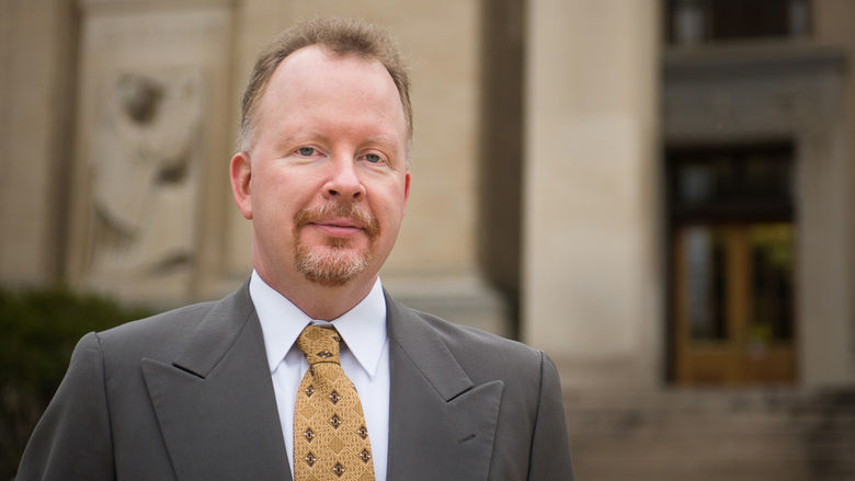 Mark Brennan stands on the Penn State University Park campus.