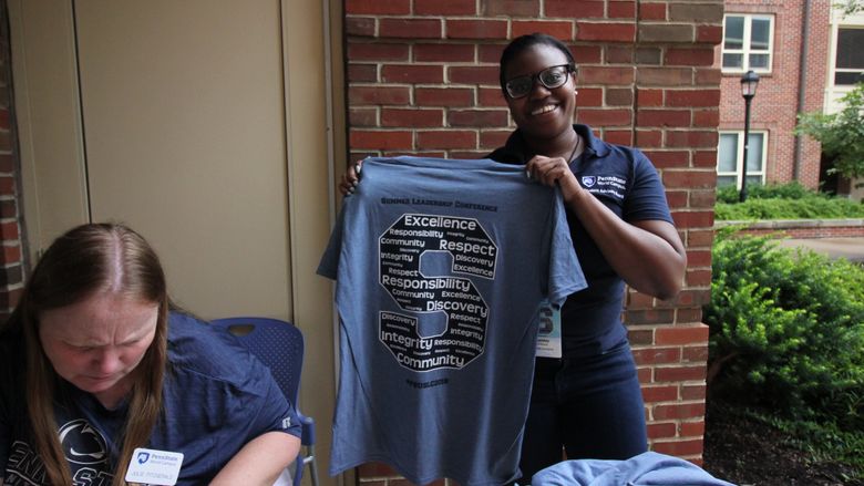 Penn State staff checks-in delegates to the Summer Leadership Conference