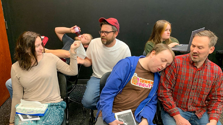 Male and female members of the Penn Players acting out a scene with an annoying audiencxe for "Hamlet"