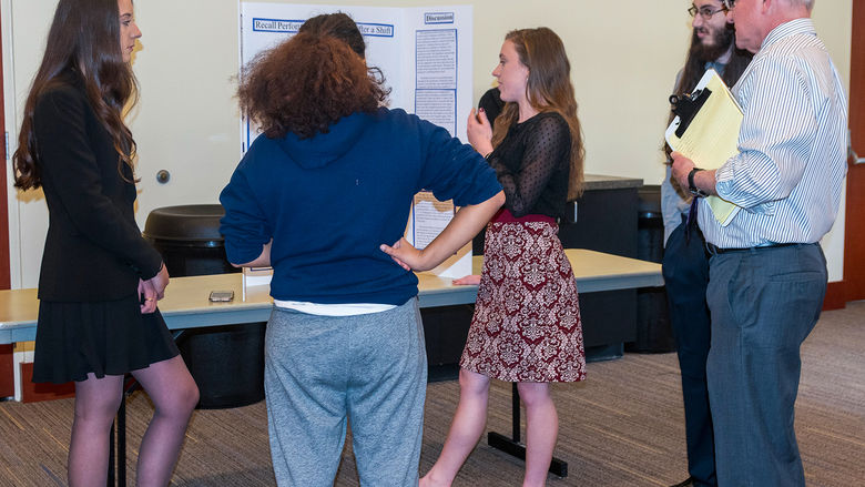 Students presenting their research at the Cognitive Psychology Research Fair hosted on campus.