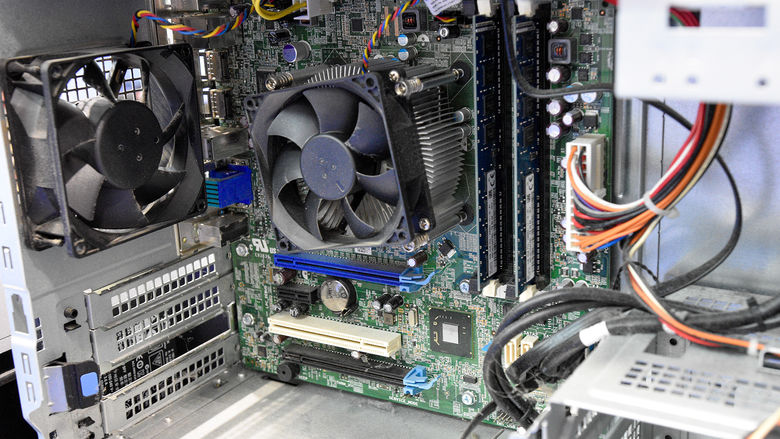 The internal workings of an old PC workstation.