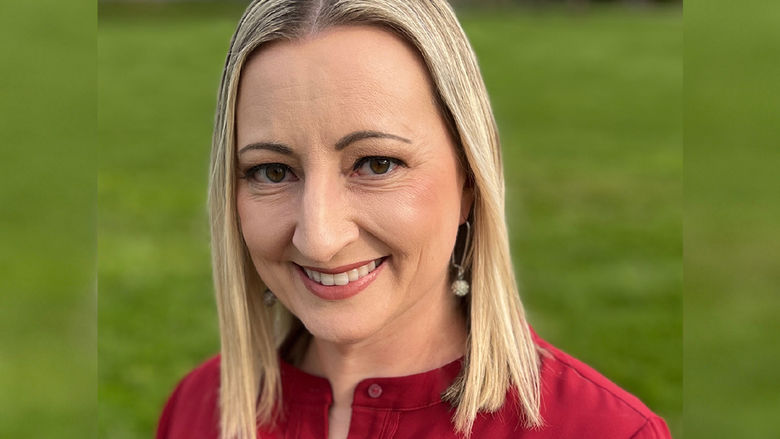 Women with shoulder-length blonde hair wearing a red blouse.