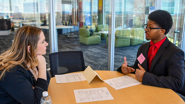 Students members of the Future Business Leaders of America (FBLA) Collegiate program participating in a professional critiquing event.