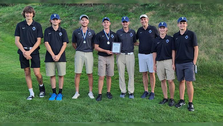 Golf team and coaches (eight males) show off the first-place trophy Penn State York won