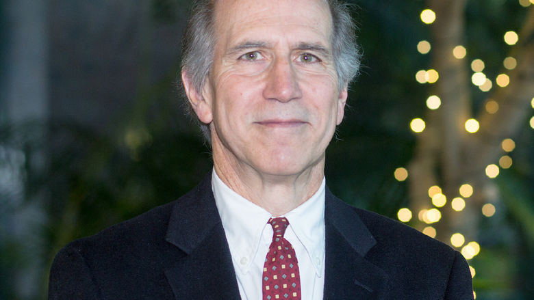 Older white male dressed in a suit and tie