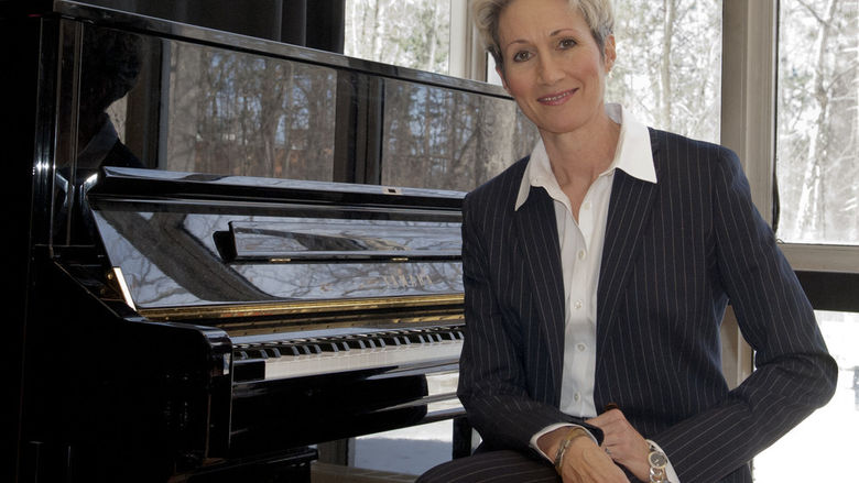 Susan sitting at a piano