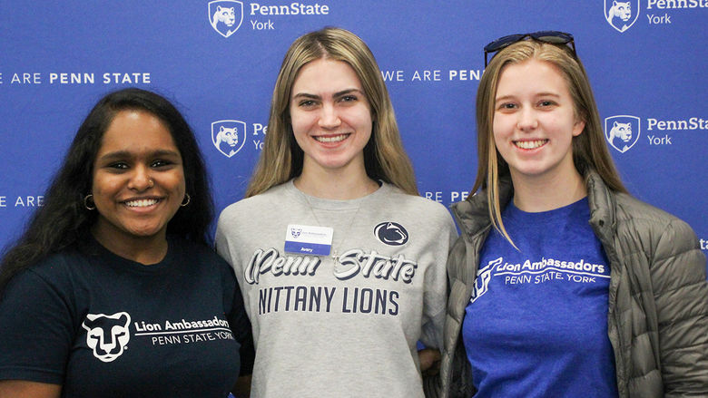 Three students involved in the Lion Ambassador program.