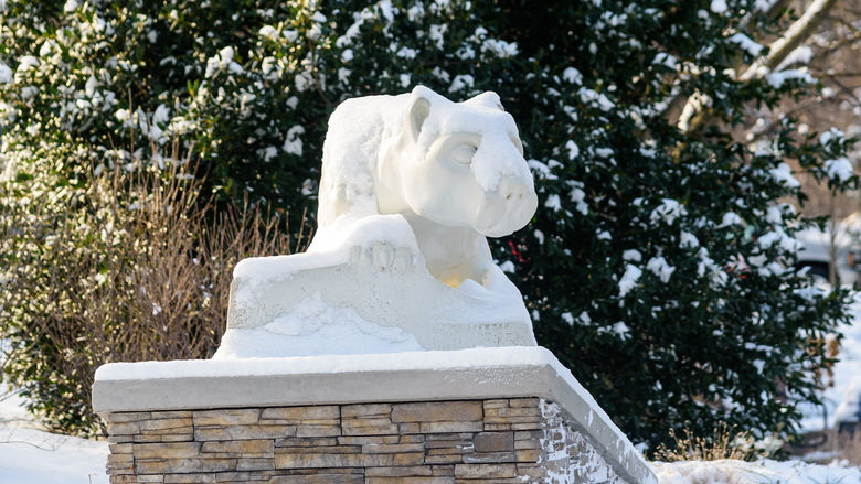 The Nittany Lion statue at Penn State York topped by a light layer of snow.
