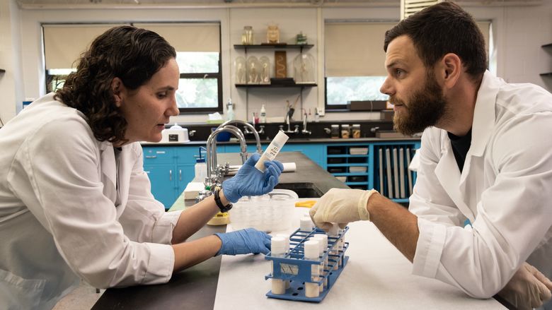Dr. Anne Vardo-Zalik and Greg Lutz Performing Research