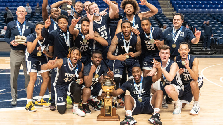 Penn State York Men’s Basketball Celebrates with the 2019 PSUAC Championship trophy
