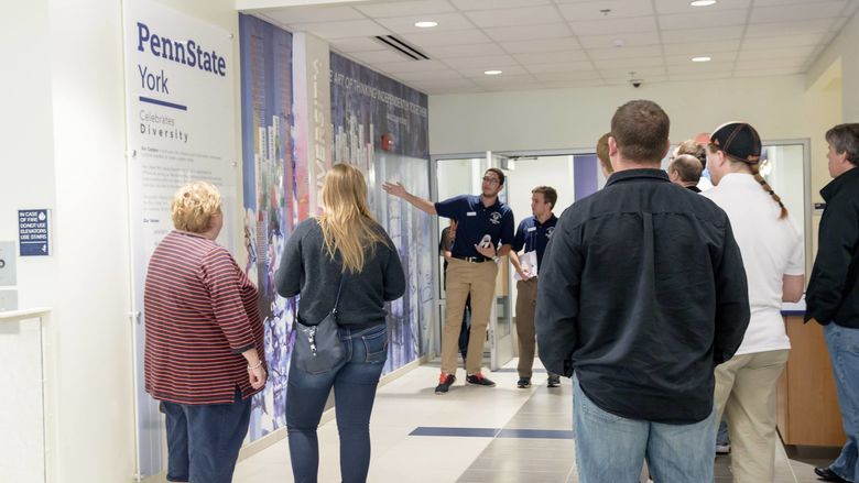 Lion Ambassador Mohamed El Sonbaty gives a tour outside of the Student Affairs office