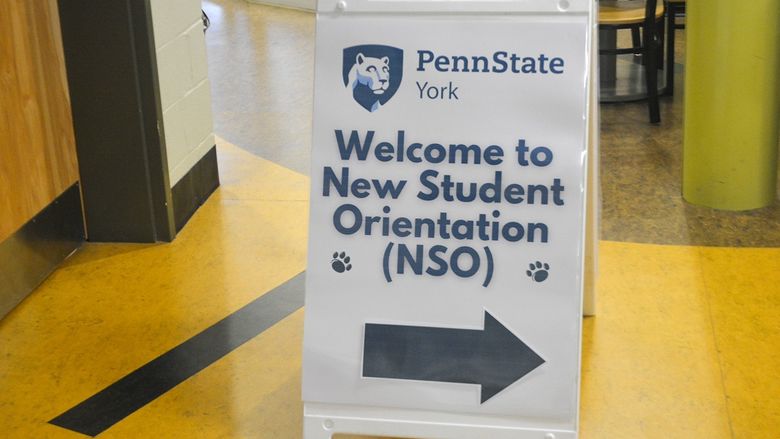 Sandwich board sign with Penn State York logo, welcoming new students.