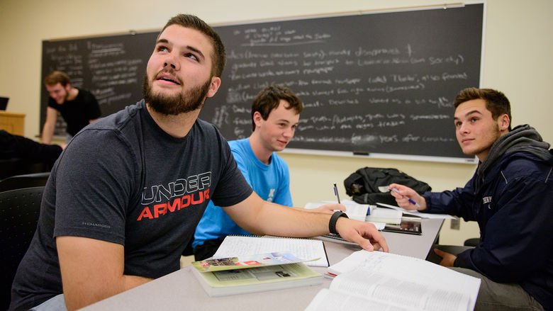 Students working in a group during a political science class with Jon Price, Instructor in History and Political Science.