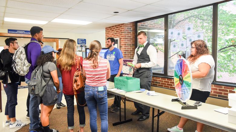 Students and staff gather at a Stand for State promotional event.