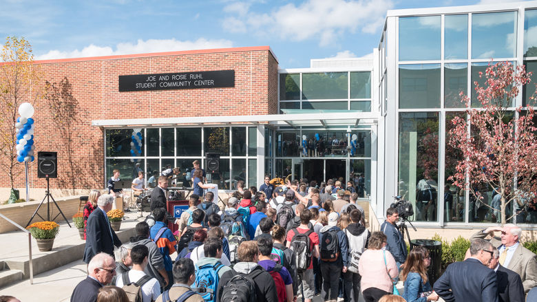 Attendees enter the student center from outside.