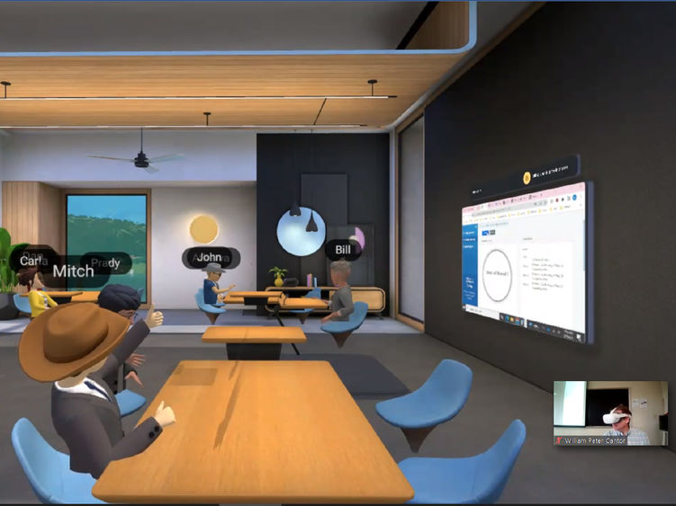 Virtual reality classroom with students seated at tabels, faculty member wearing VR headset embedded in lower right of photo