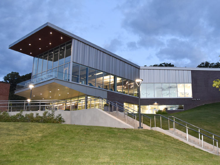 Buildingwith lots of glass sitting atop a hill