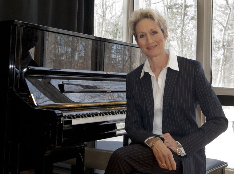 Susan sitting at a piano