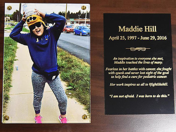 Plaque with the name and photo of the late Maddie Hill