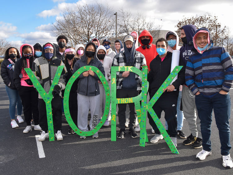 Group of students holding green wooden letters spelling York